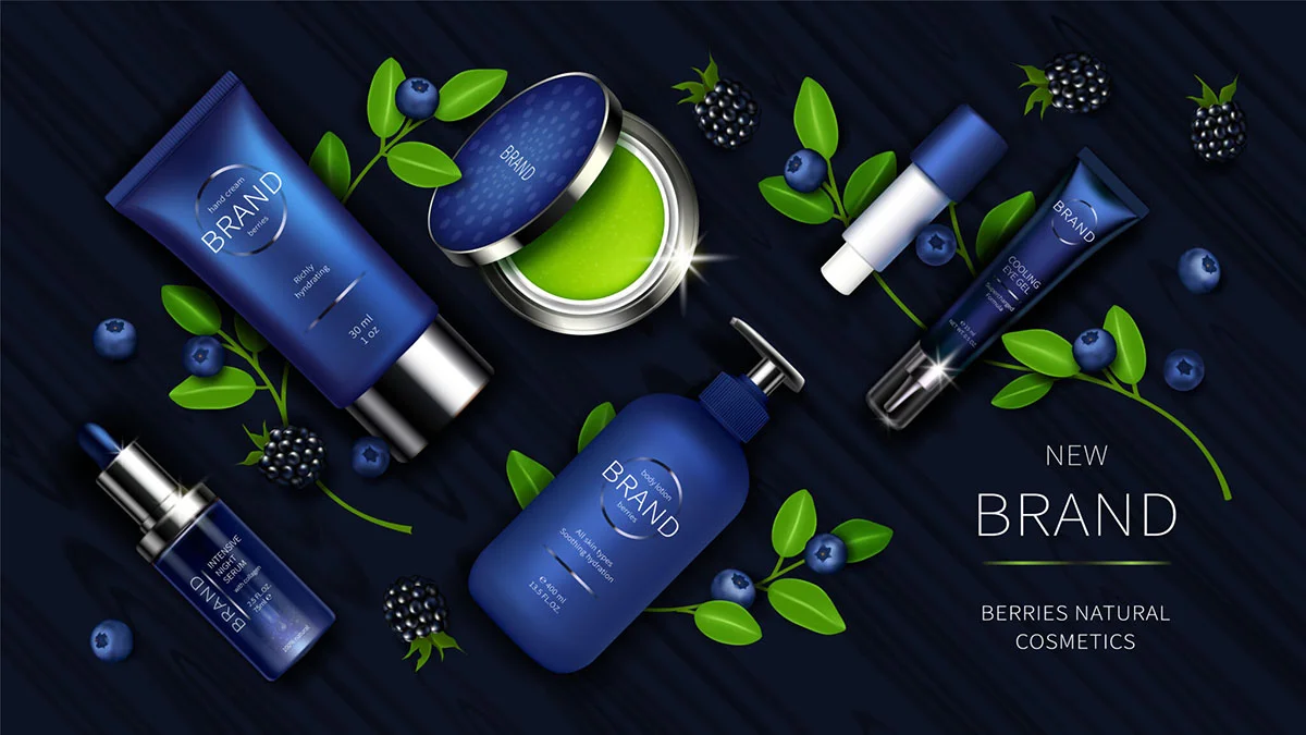 Assortment of skincare products in blue packaging surrounded by blueberries and blackberries on a dark background.